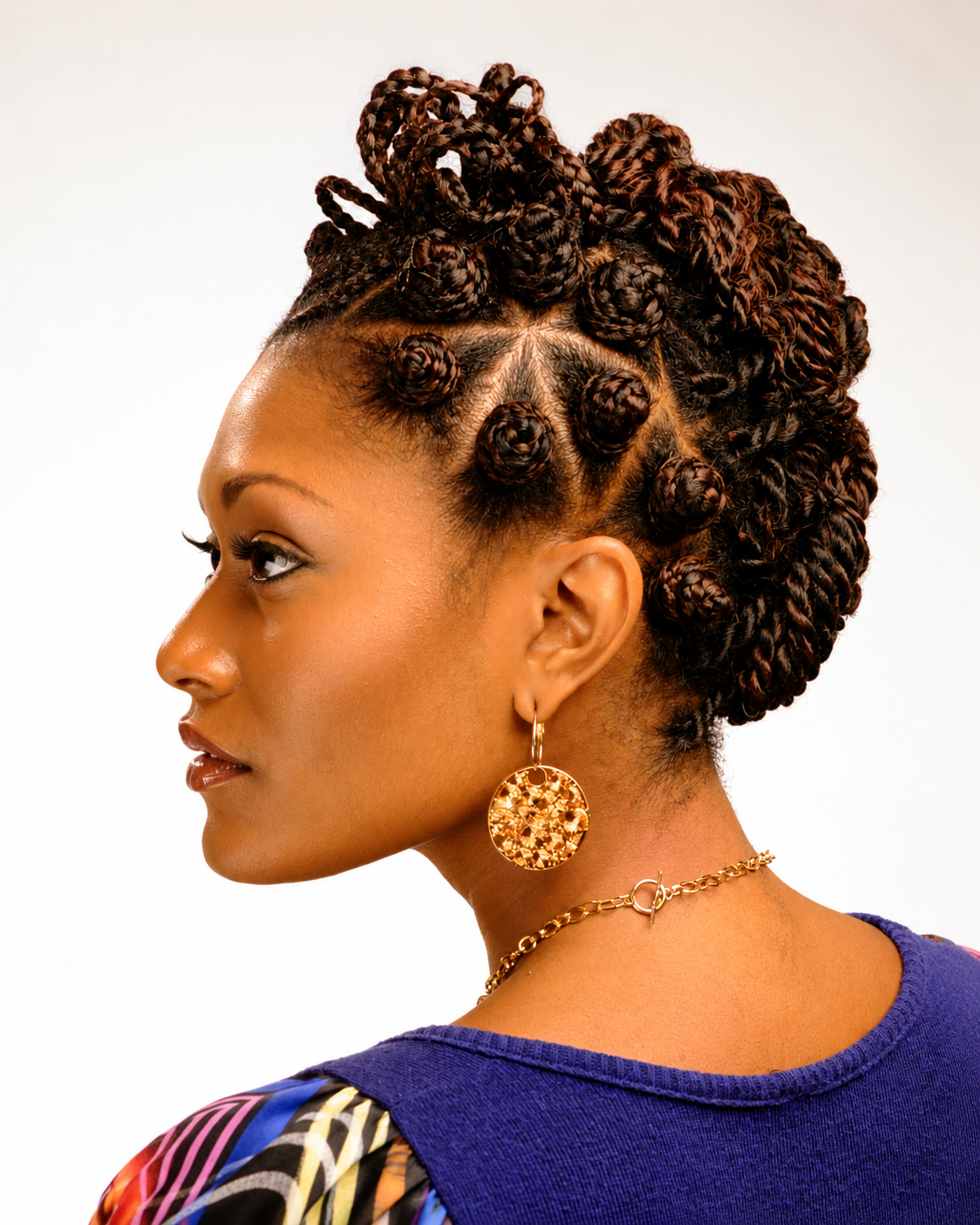 Defined curls styled in an elegant updo